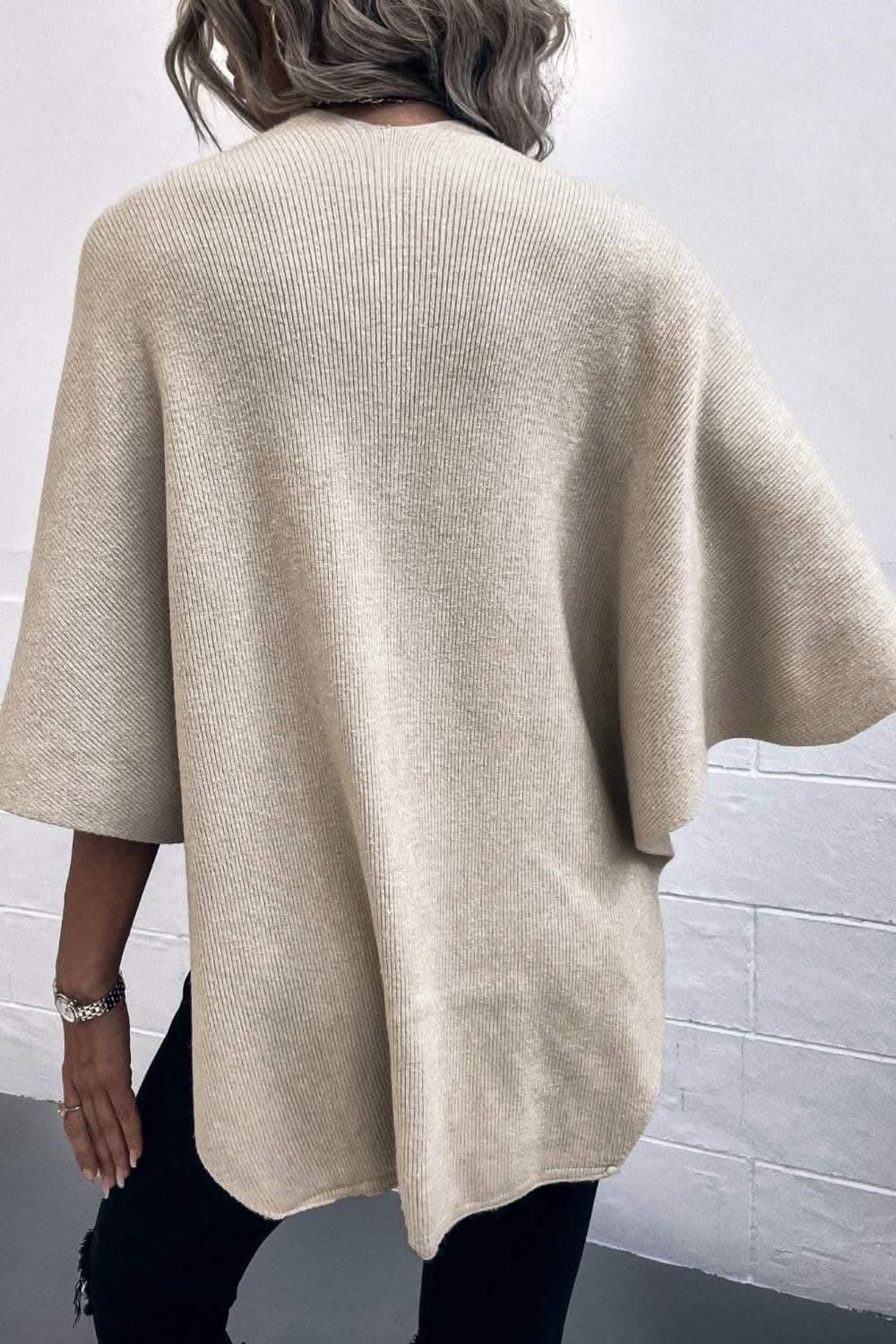 Ponchos Trendsi Chic poncho with pom-pom trim