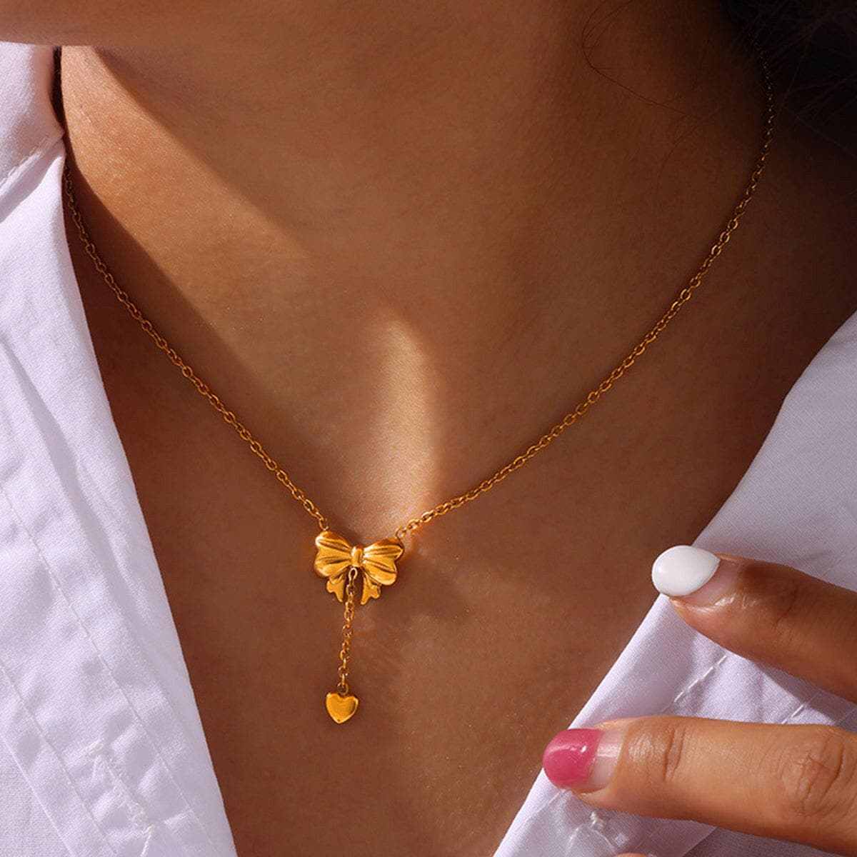 T-Shirts Trendsi Titanium steel gold bow necklace